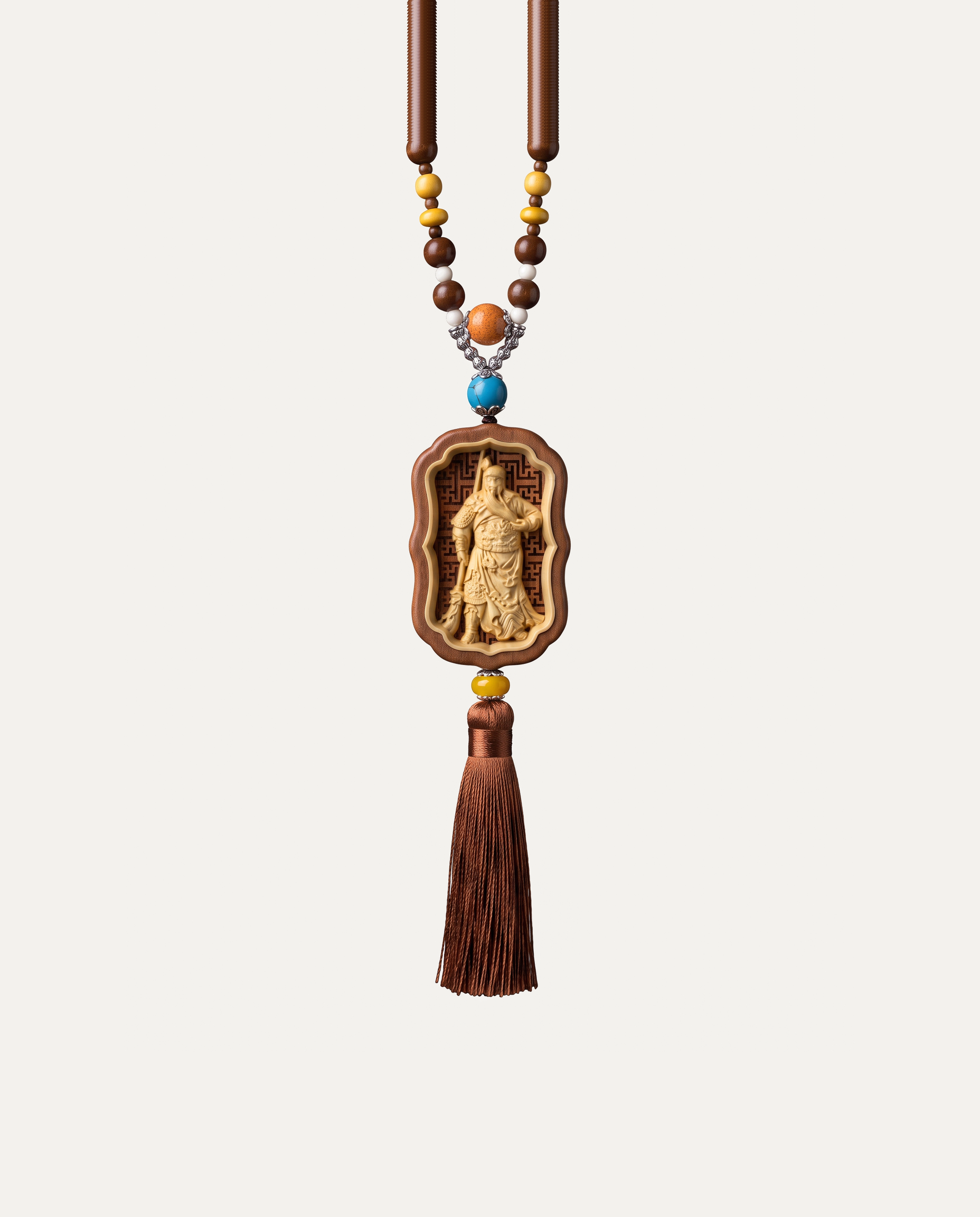 Guan Gong carved boxwood hanging charm with beads and tassel, studio photo