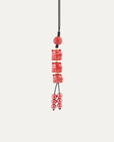 Three Lucky Cats Cinnabar Hanging Charm, studio photo