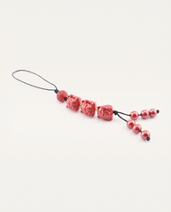 Three Lucky Cats Cinnabar Hanging Charm, studio photo