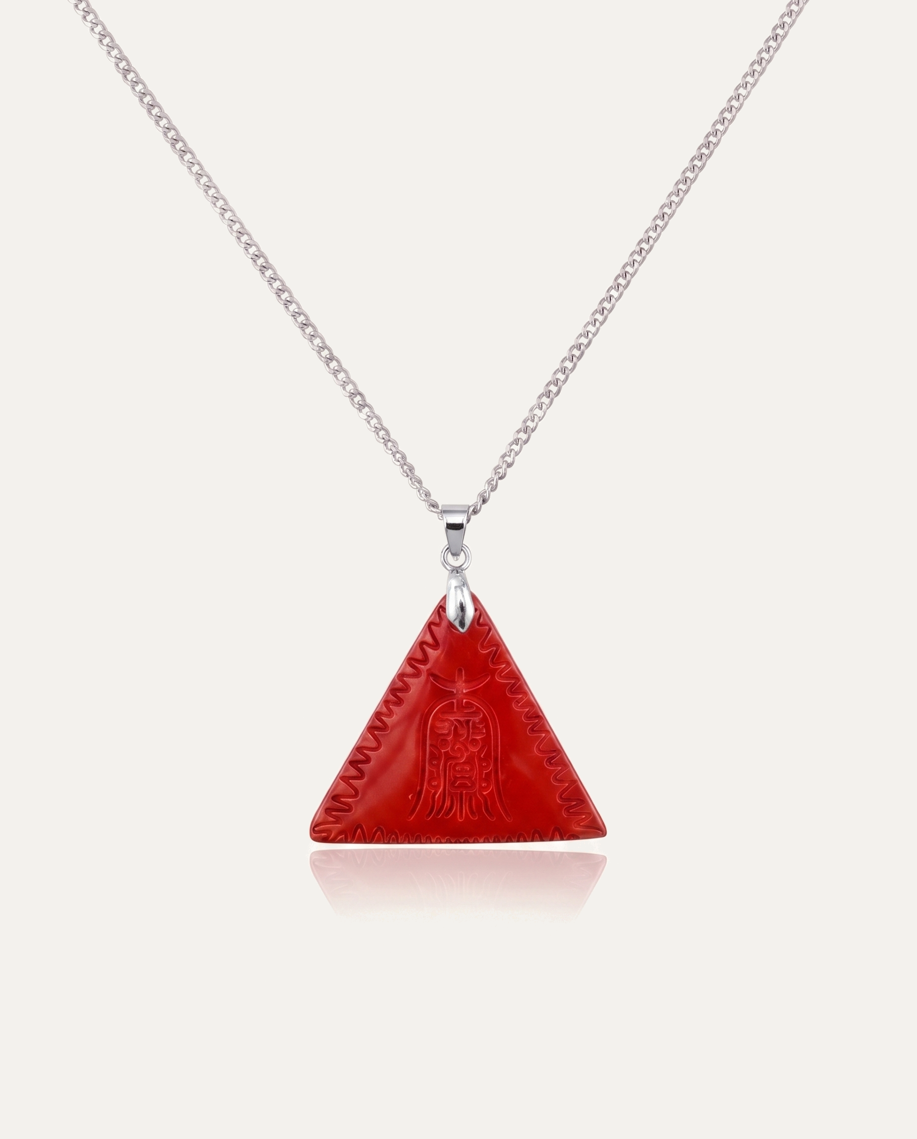 Red Amitabha Triangle Cinnabar Pendant on silver chain, ivory background