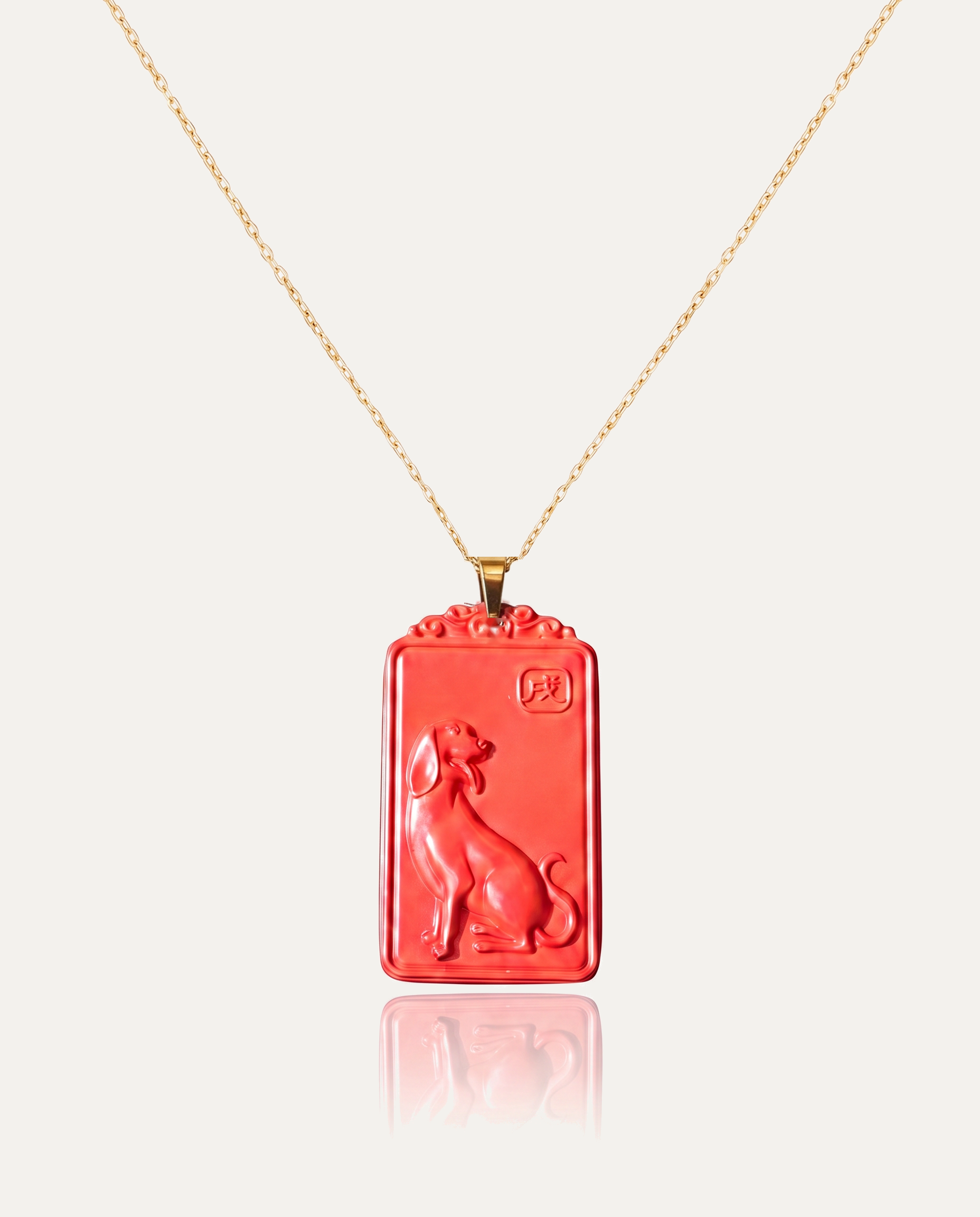 Dog zodiac cinnabar pendant necklace gold chain on ivory background