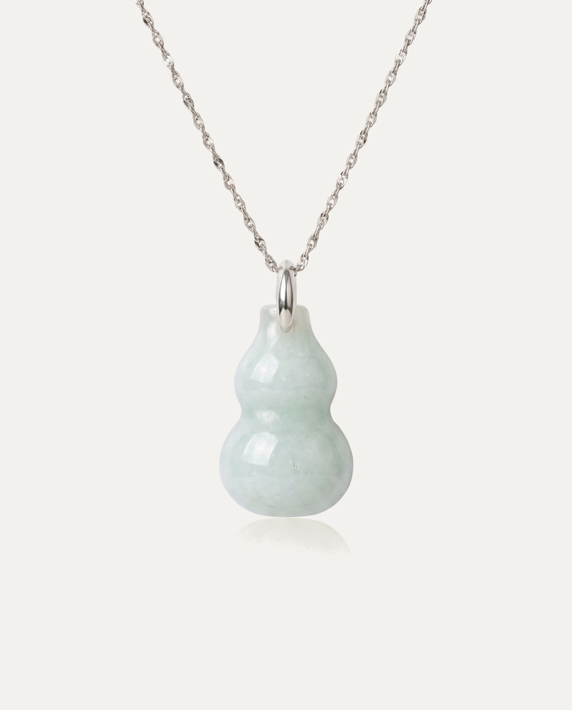 Jade Hulu Gourd Necklace with silver chain on ivory background
