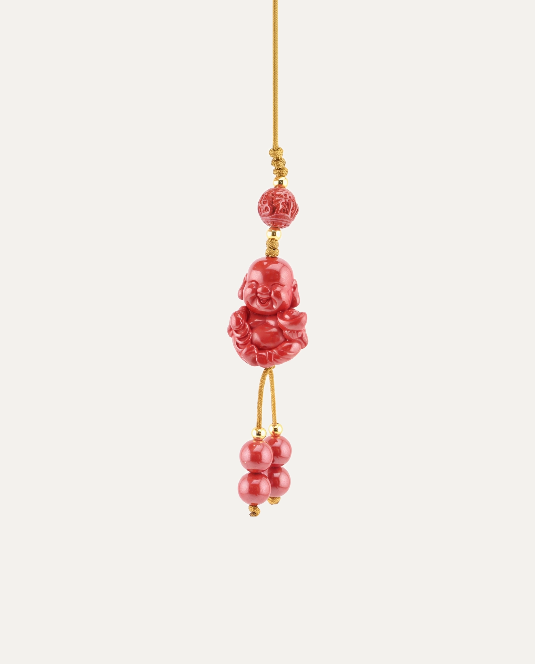 Laughing Buddha Cinnabar Hanging Charm, studio photo