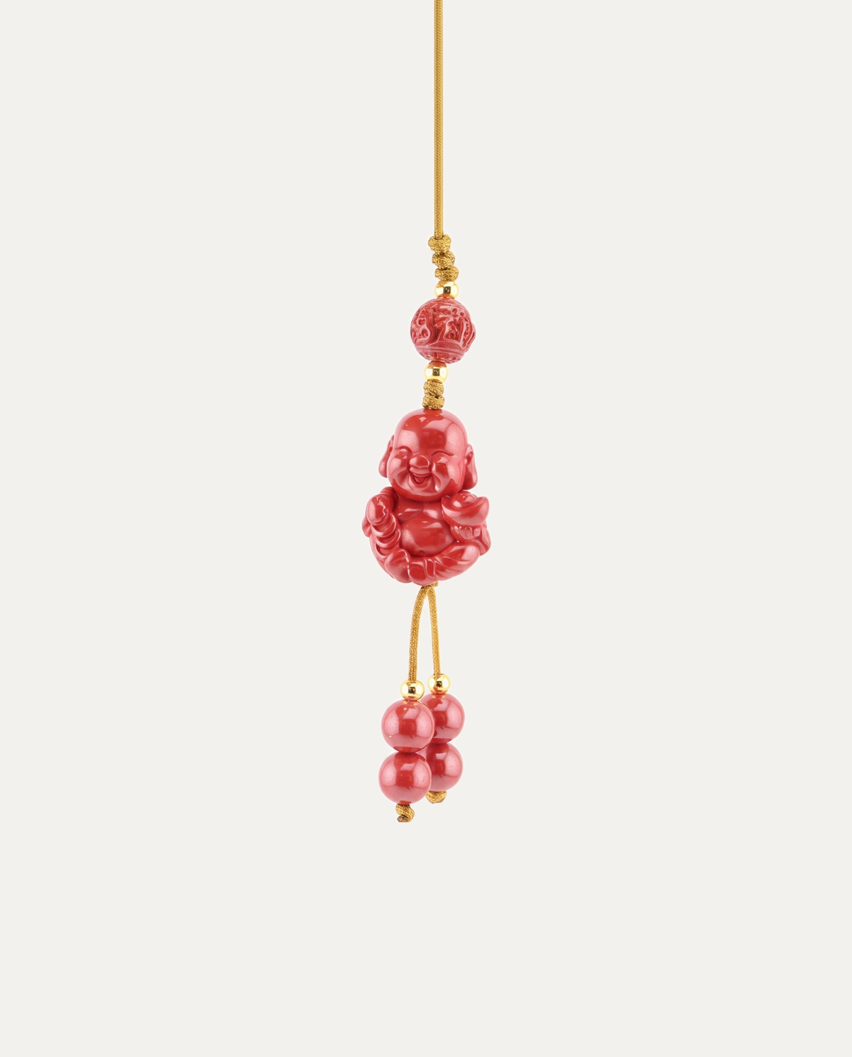 Laughing Buddha Cinnabar Hanging Charm, studio photo