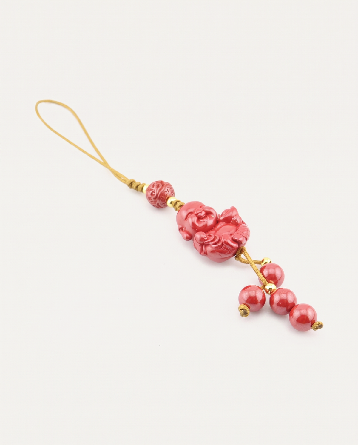 Laughing Buddha Cinnabar Hanging Charm, studio photo