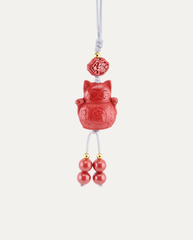 Lucky Cat Cinnabar Hanging Charm, studio photo