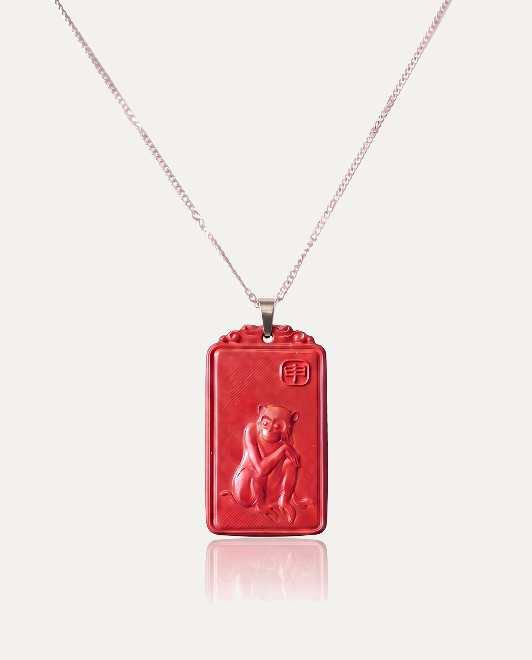 Monkey zodiac cinnabar pendant necklace silver chain on ivory background