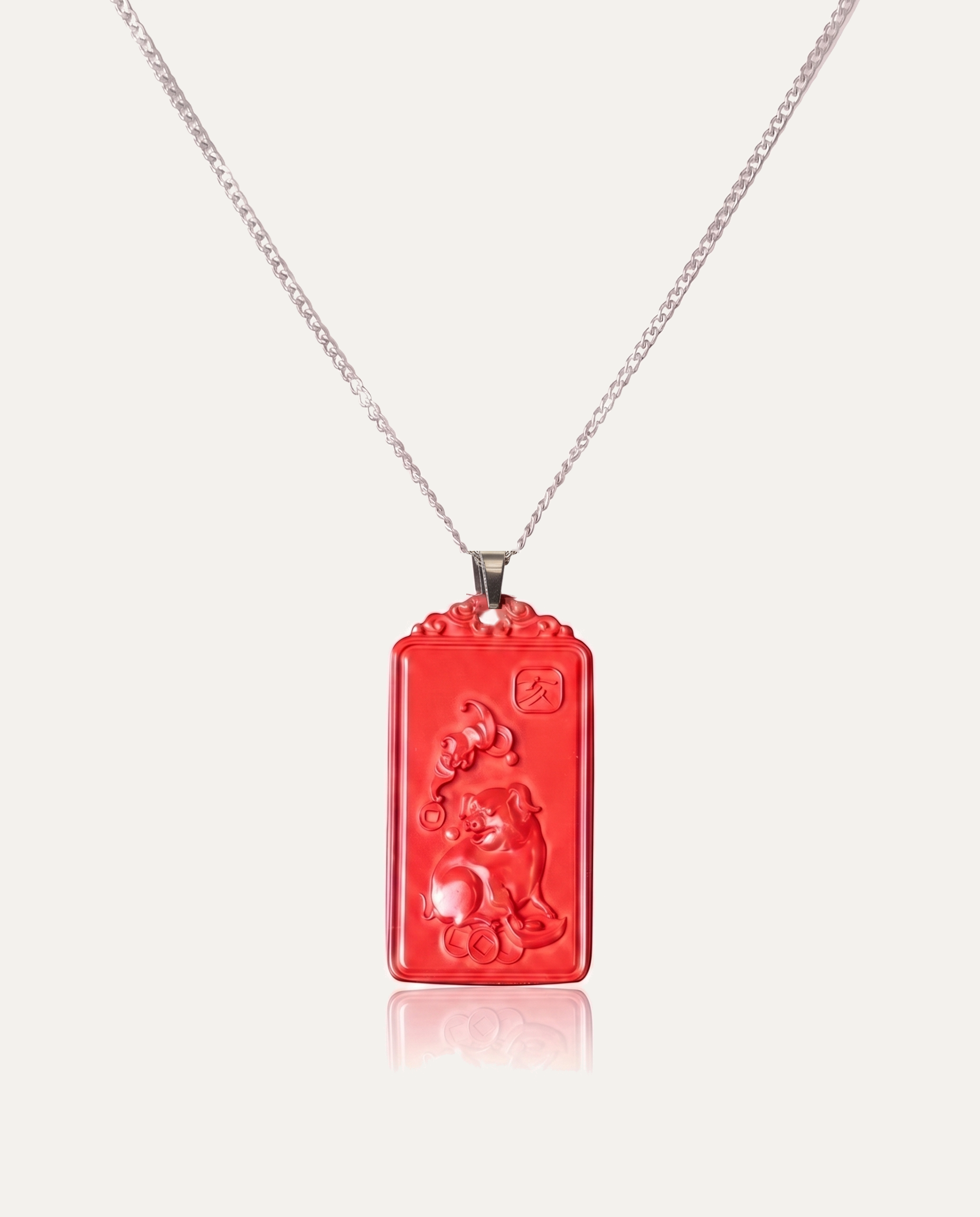 Pig zodiac cinnabar pendant necklace silver chain on ivory background