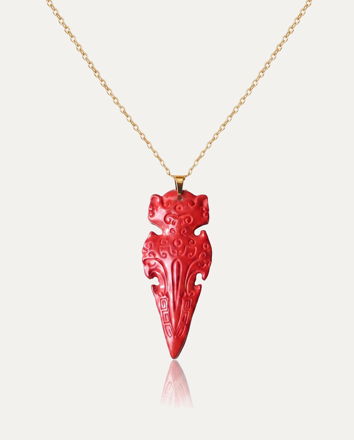 Protection arrow cinnabar pendant necklace gold chain on ivory background