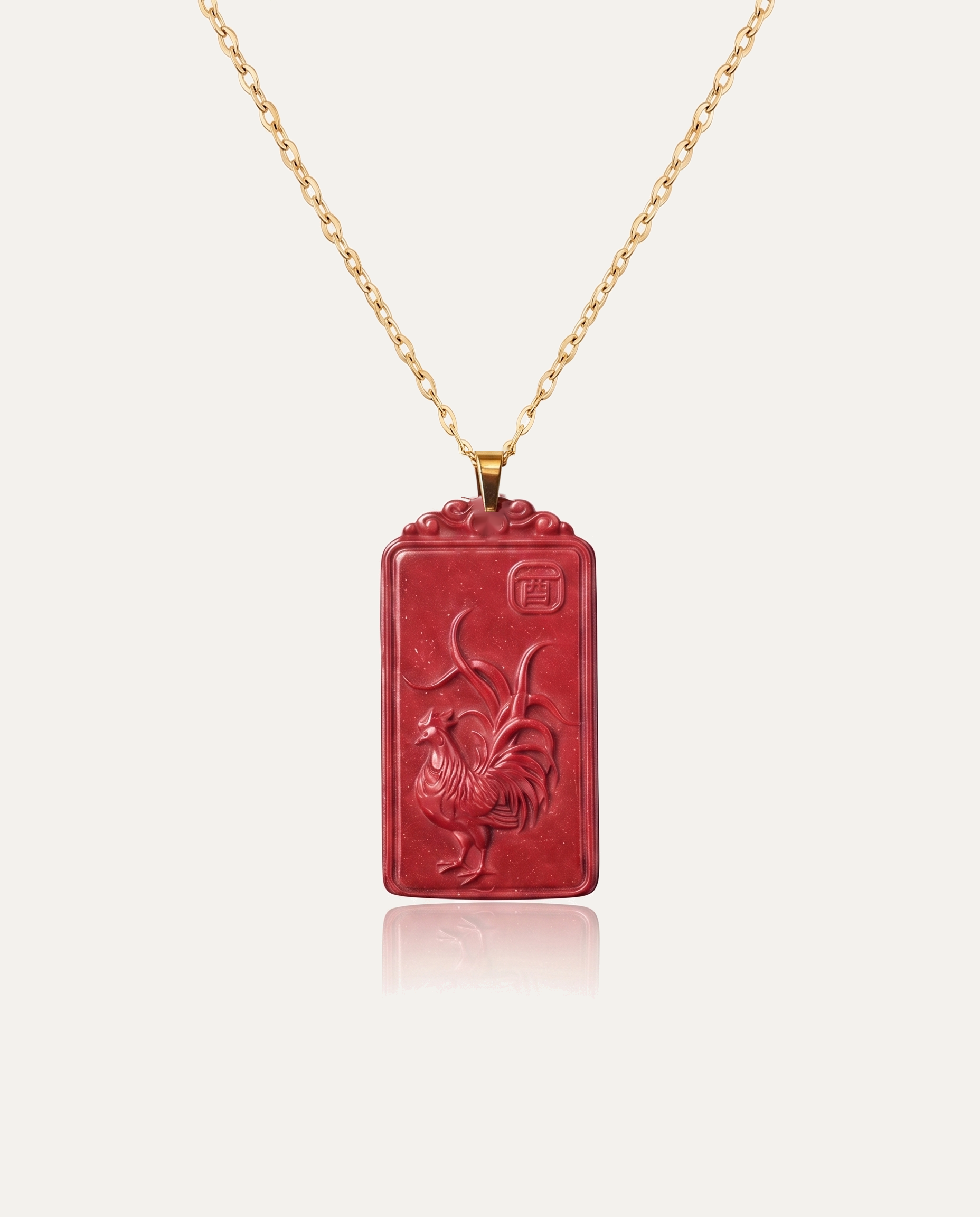 Rooster zodiac cinnabar pendant necklace gold chain on ivory background