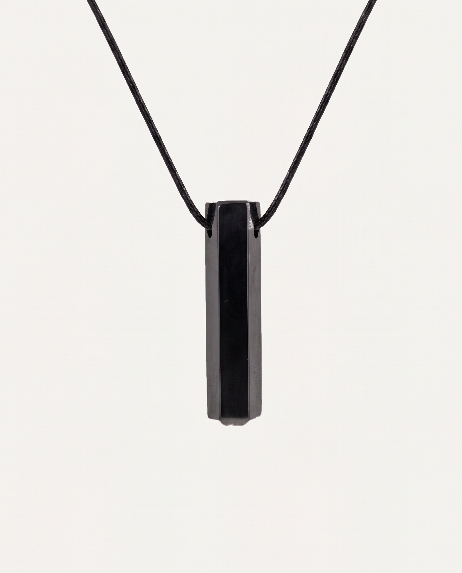 Shungite Prism Pendant Necklace on black cord, studio photo