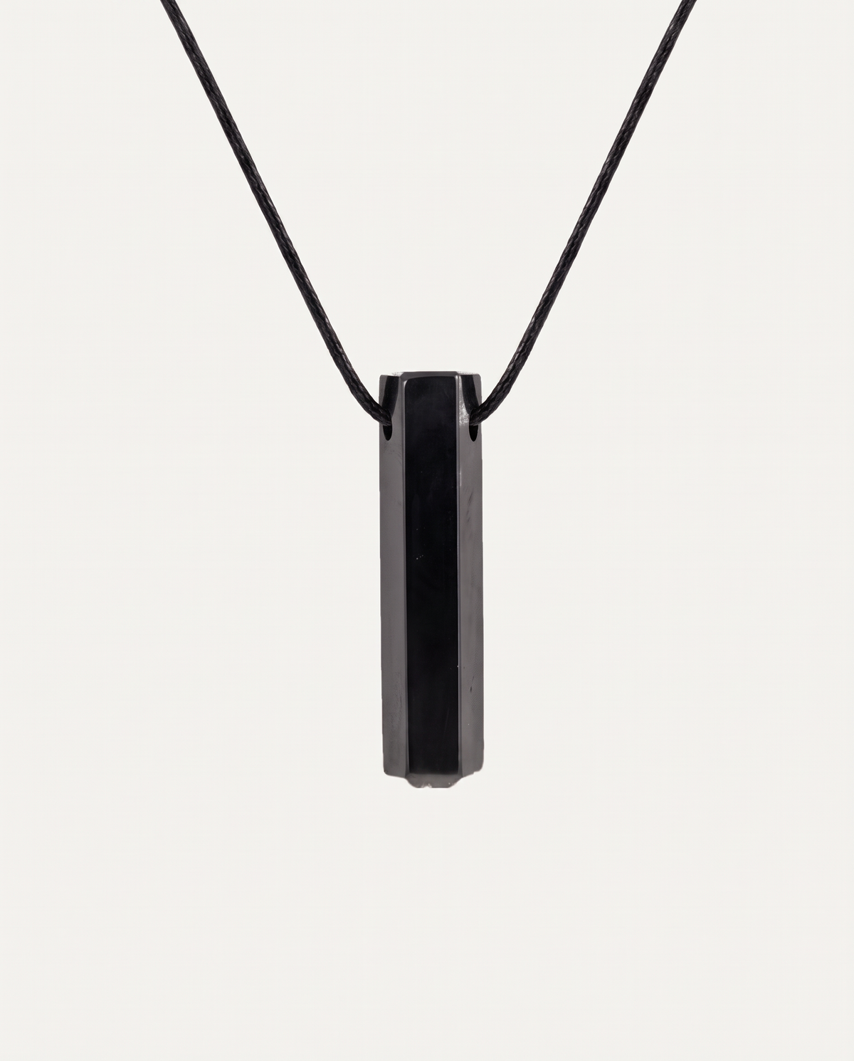 Shungite Prism Pendant Necklace on black cord, studio photo