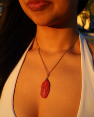 Six Character Mantra cinnabar pendant necklace worn