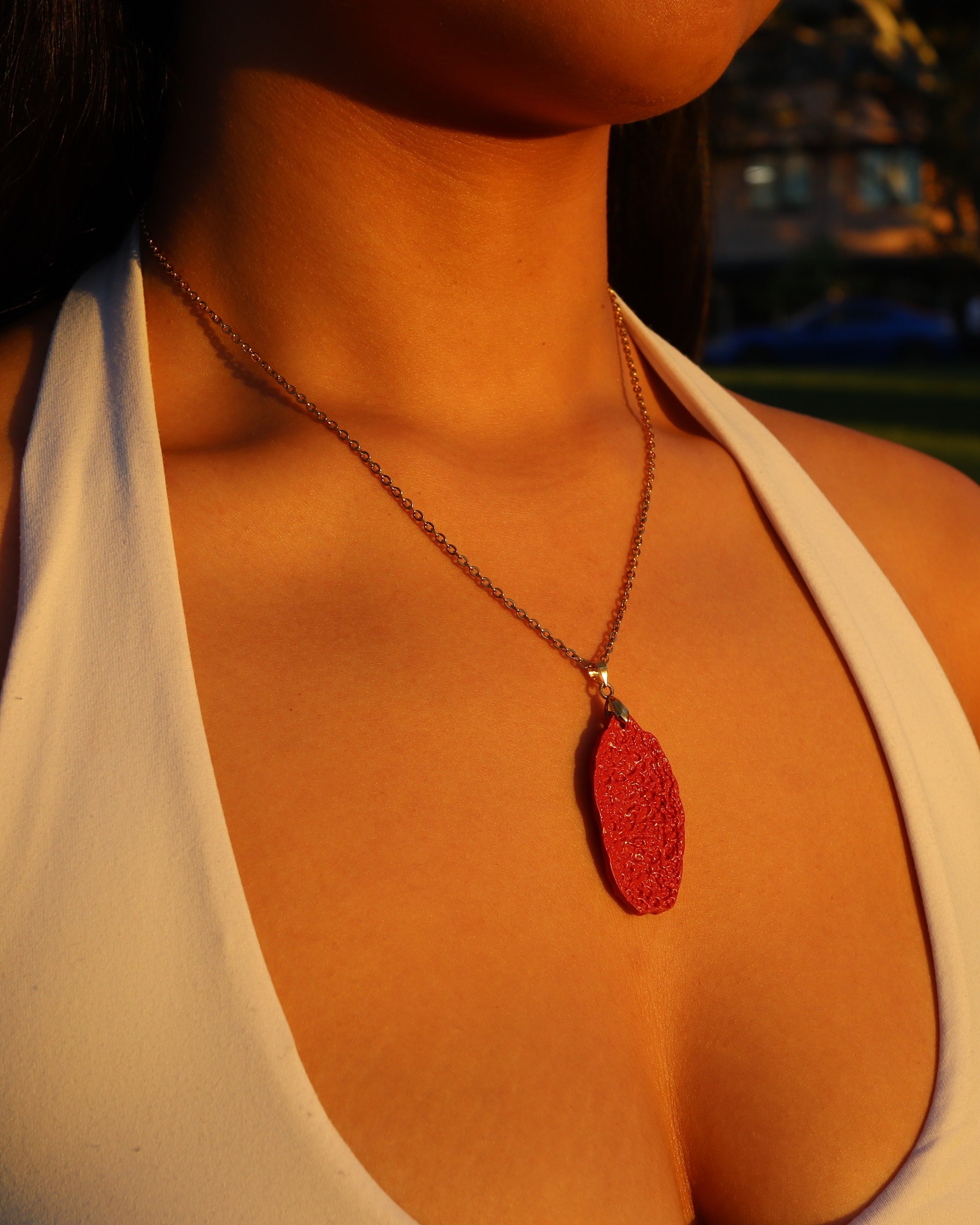 Six Character Mantra cinnabar pendant necklace worn