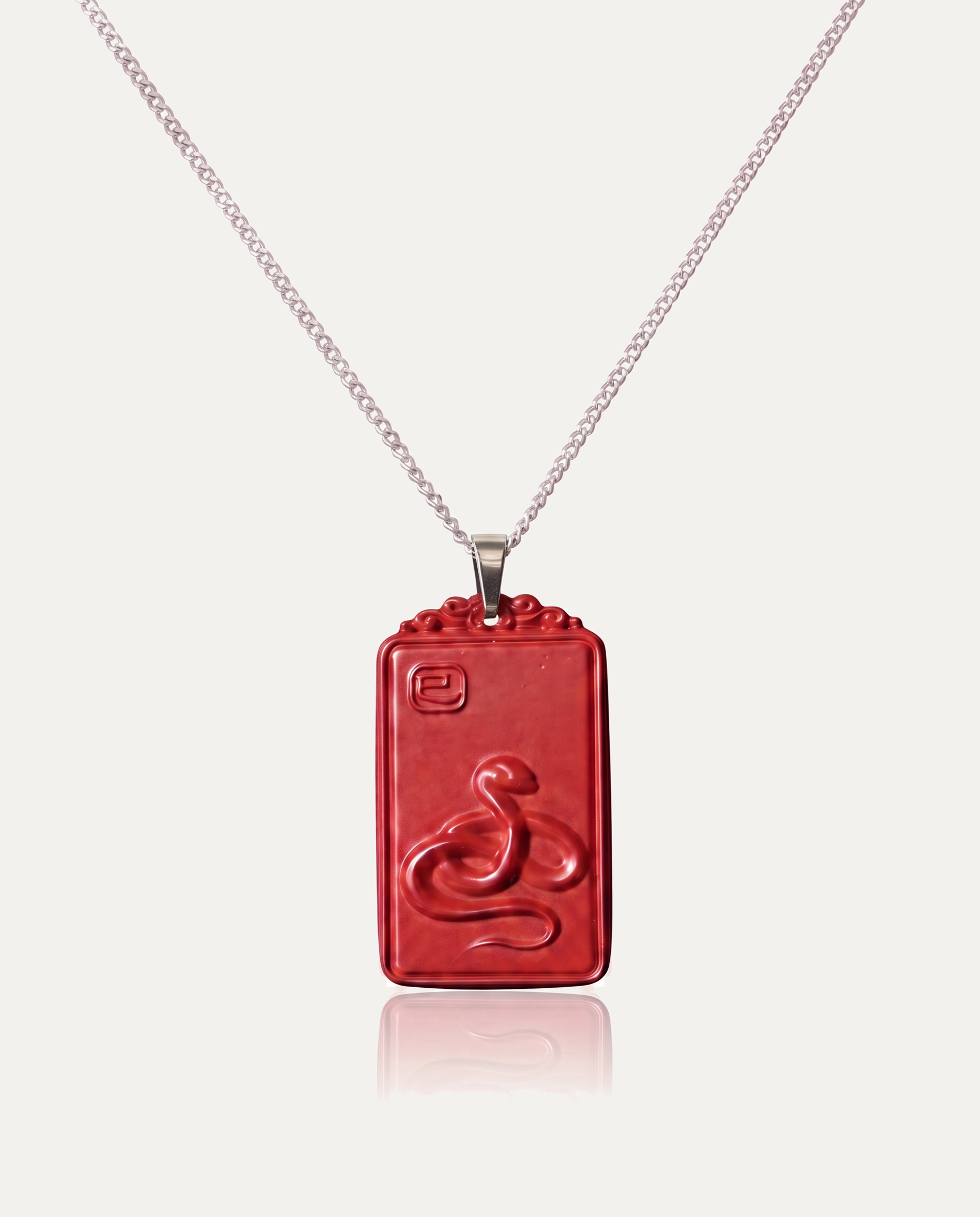 Snake zodiac cinnabar pendant necklace silver chain on ivory background
