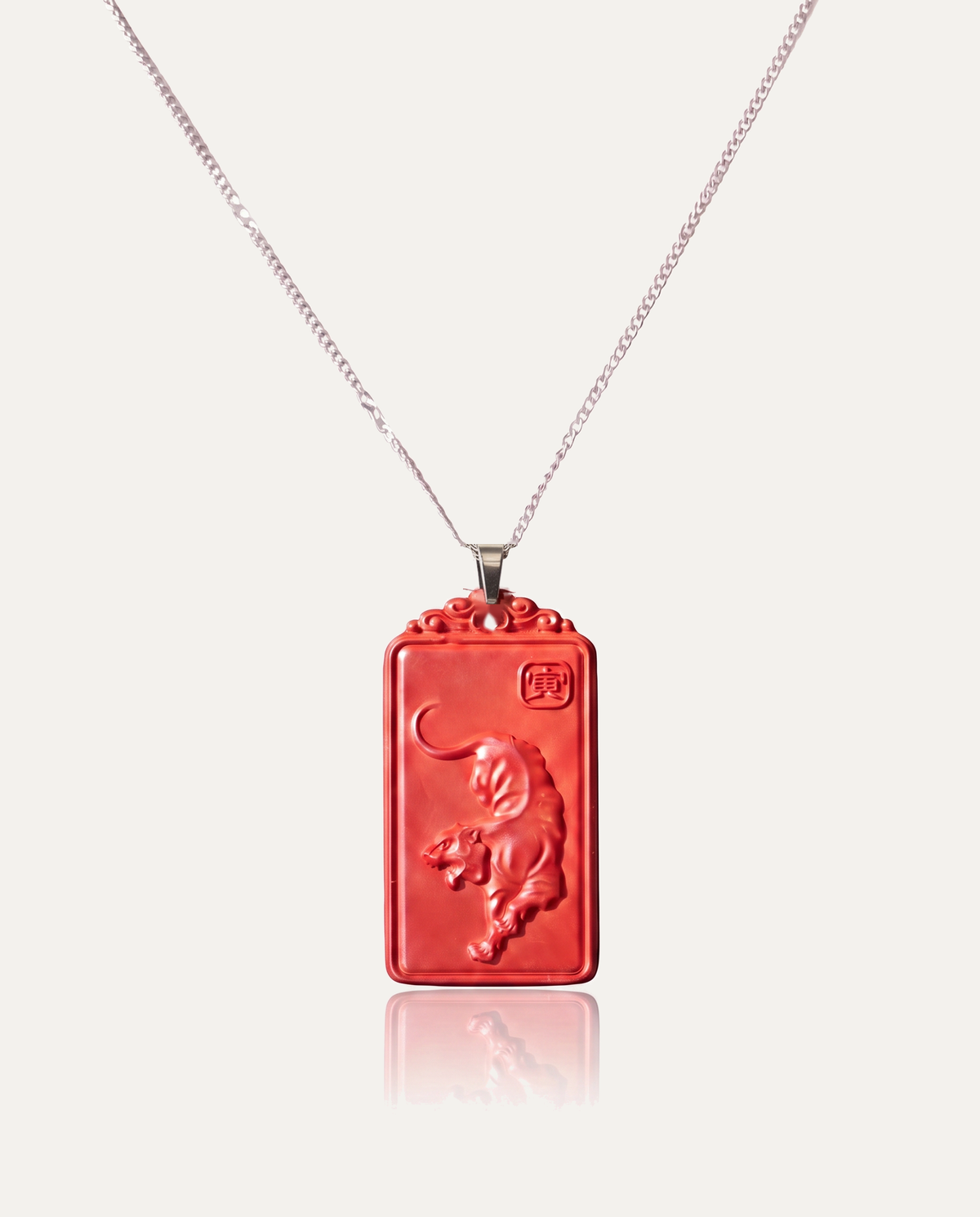 Tiger zodiac cinnabar pendant necklace silver chain on ivory background