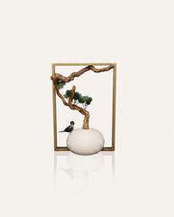 Two birds on a pine branch sculpture