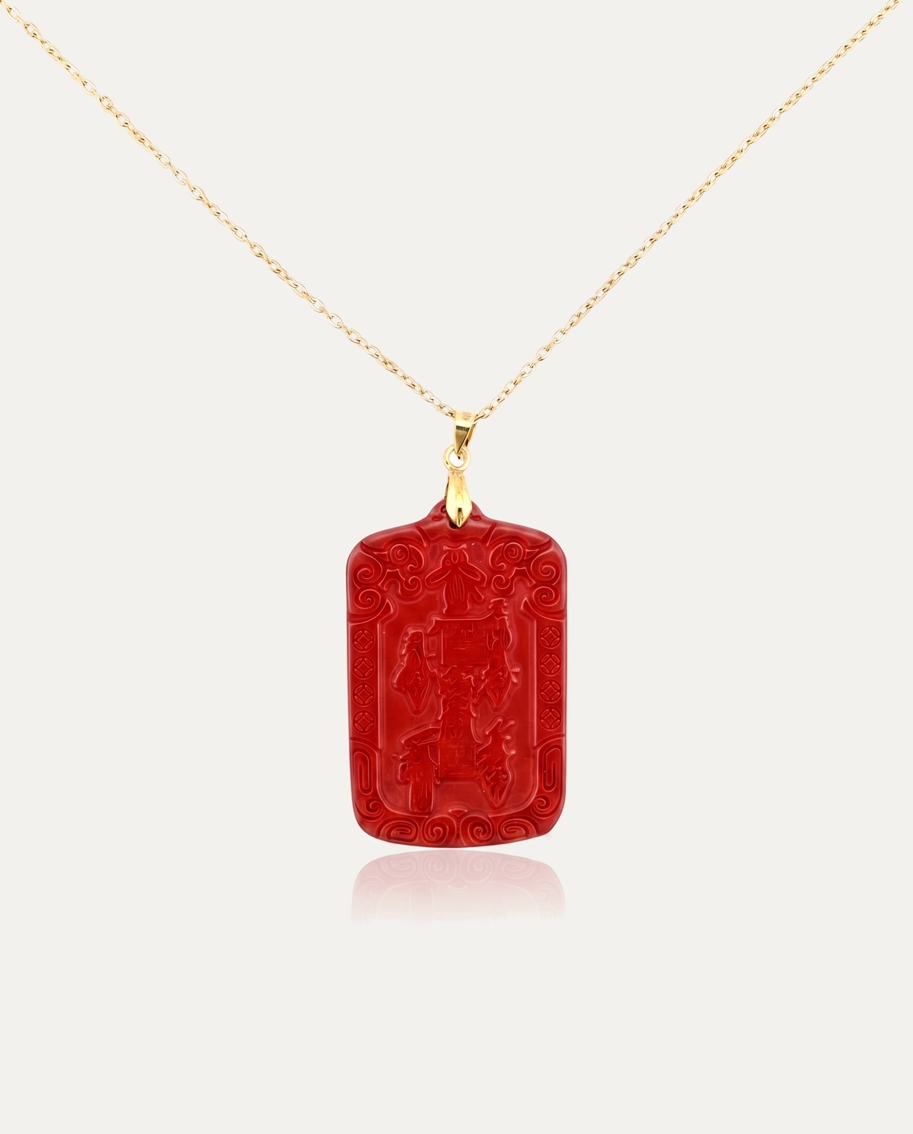 Wealth talisman cinnabar pendant necklace gold chain on ivory background