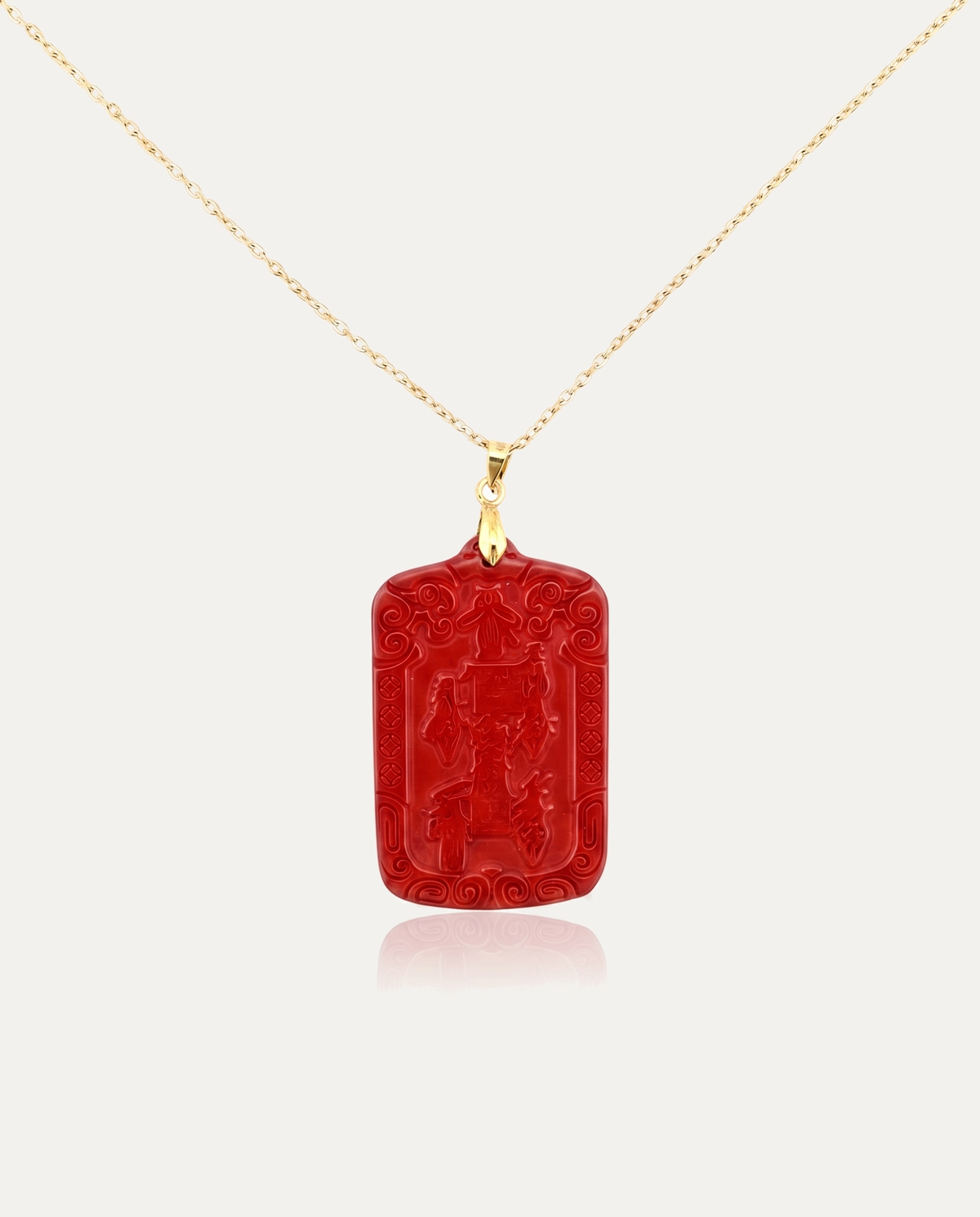 Wealth talisman cinnabar pendant necklace gold chain on ivory background