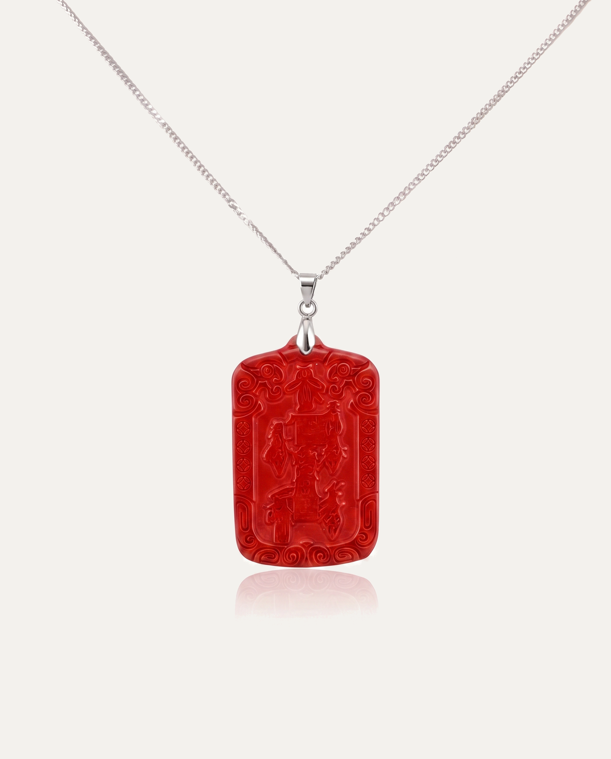 Wealth Talisman Cinnabar Pendant on silver chain, ivory background