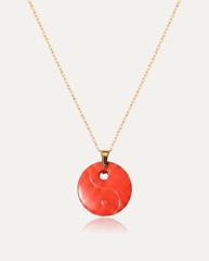Yin yang cinnabar pendant necklace gold chain on ivory background