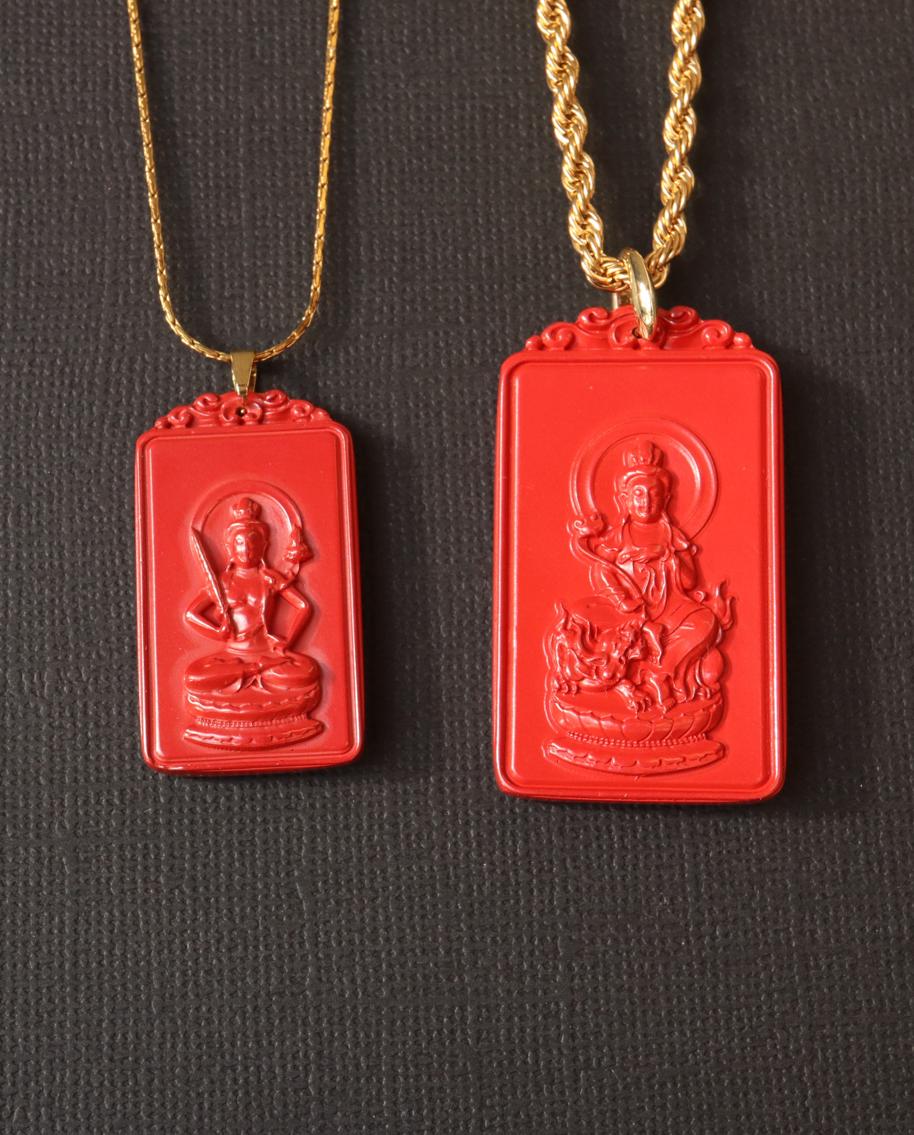 Small and Large zodiac cinnabar pendants side by side
